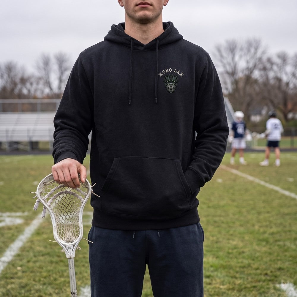 Lacrosse player on the sideline in the black Tactical Clear Hoodie with the Hobo Lax skull chest logo